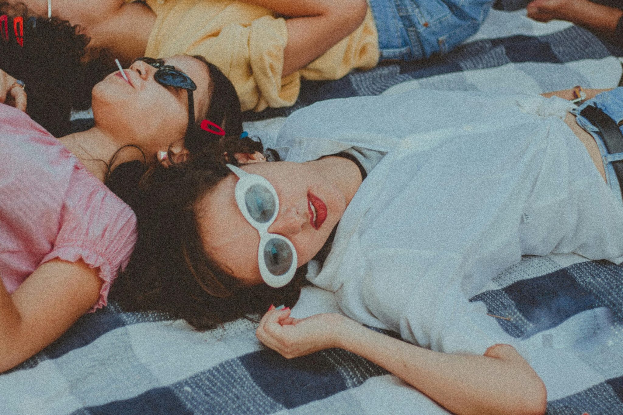 Friends relaxing together outdoors, representing community-driven brand advocacy.