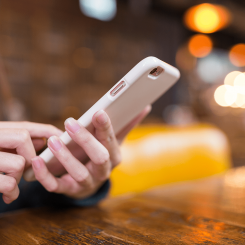 close up shot of woman swiping her phone